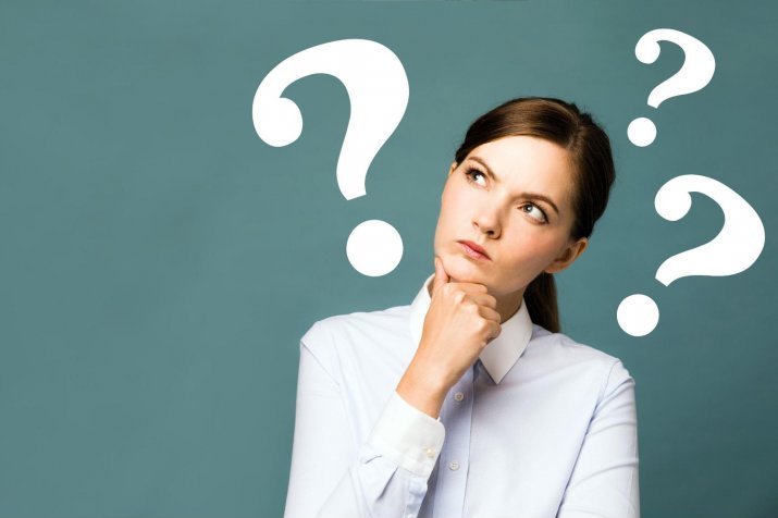 A woman with a question mark floating above her head